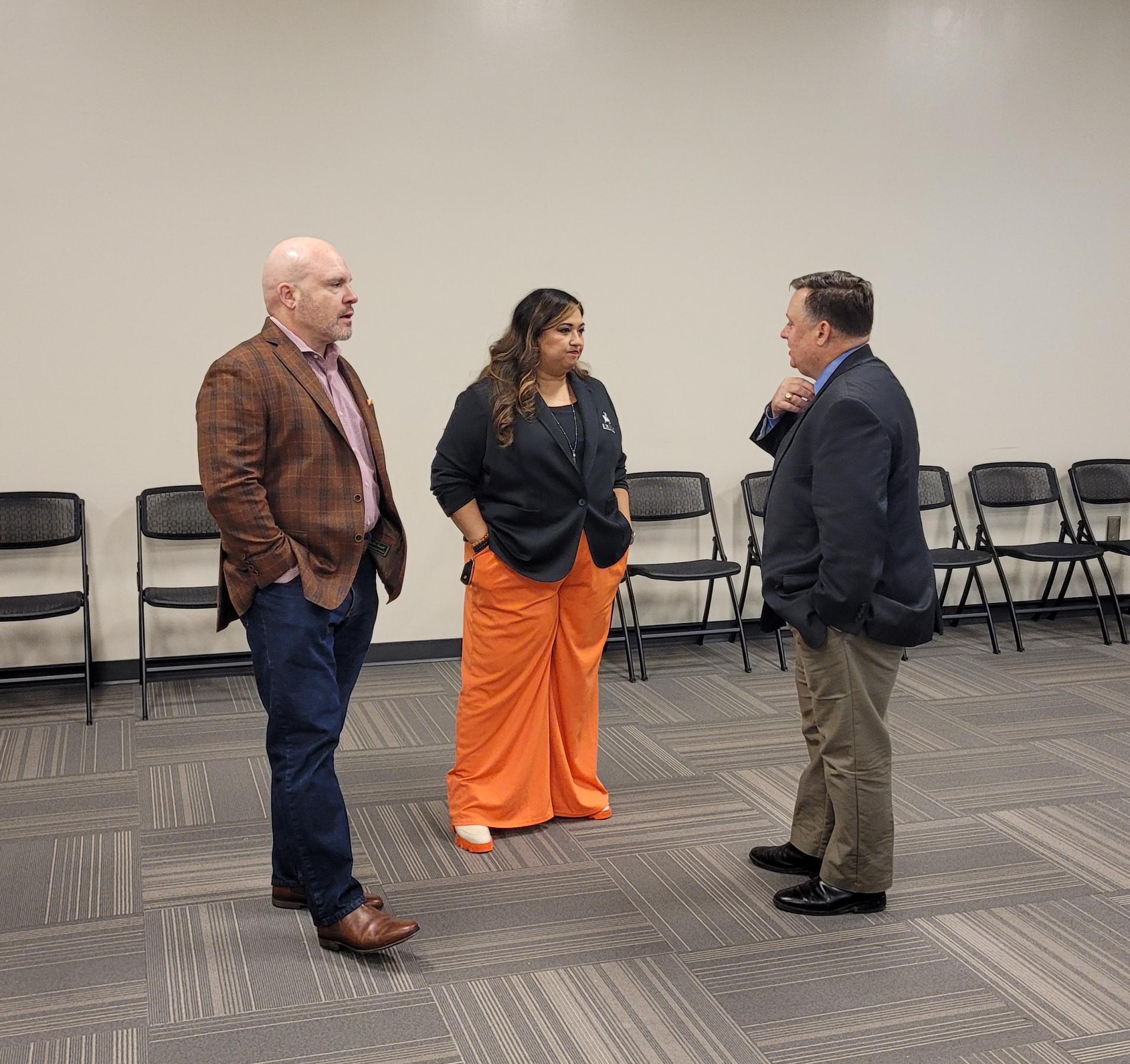 Industrial seminar guest speakers, Chris Kemper, Sami Worthington, John Blomberg, network prior to the event on December 9, 2025.